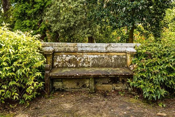 Ancient stone bench in the park