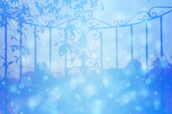 Dreamy background with beautiful, old, stylich, garden gate with bokeh lights