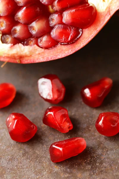 Macro shot of organic ripe red fruit pomegranate seeds