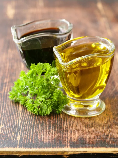 Olive oil and balsamic vinegar in a glass gravy boat