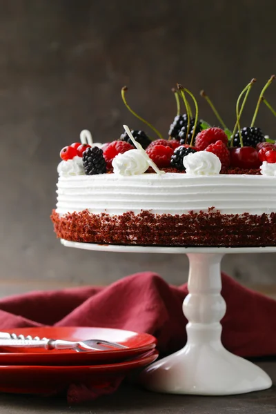 Festive cake red velvet decorated with fresh berries