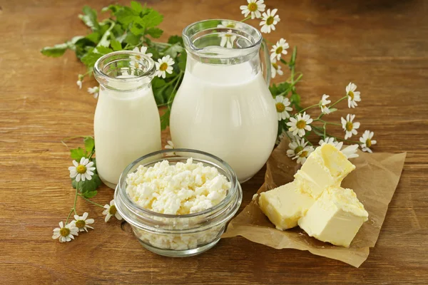 Assortment of dairy products (milk, butter, sour cream, yogurt) rustic still life