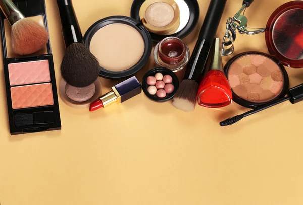 Cosmetics set for make-up (face powder, lipstick, mascara brush, nail polish, blush, eye shadow)