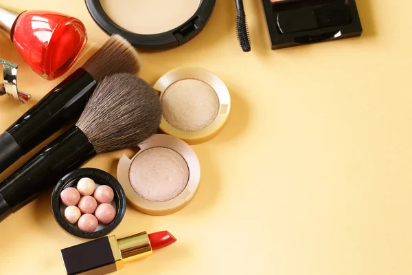 Cosmetics set for make-up (face powder, lipstick, mascara brush, nail polish, blush, eye shadow)