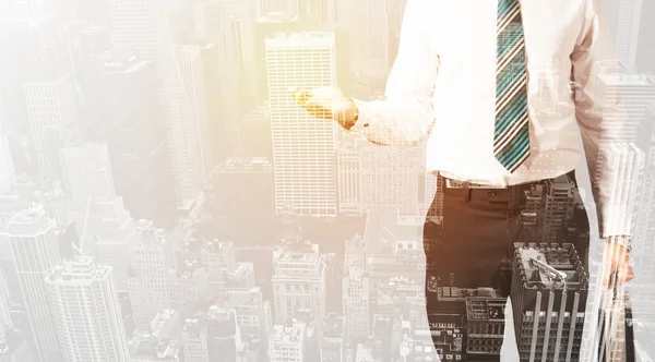 Business person with warm color overlay of city background