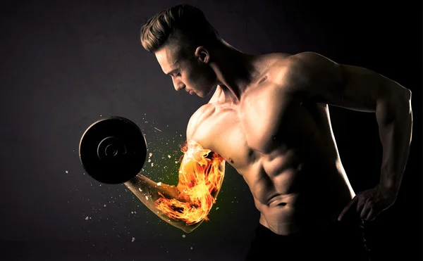 Bodybuilder athlete lifting weight with fire explode arm concept
