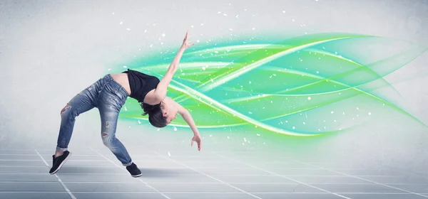 Hip hop dancer posing with green lines