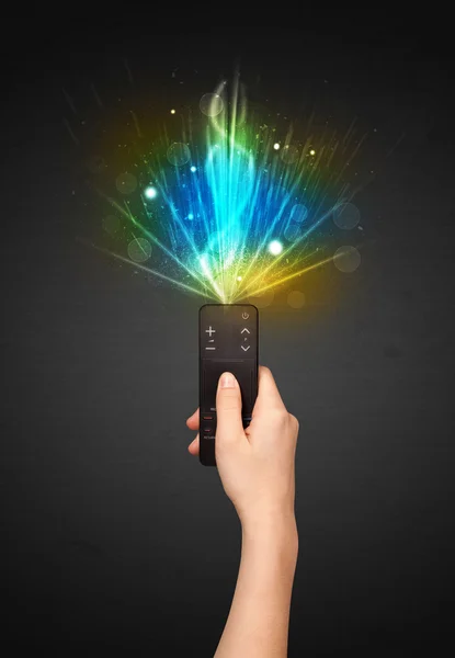 Hand with remote control and explosive signal