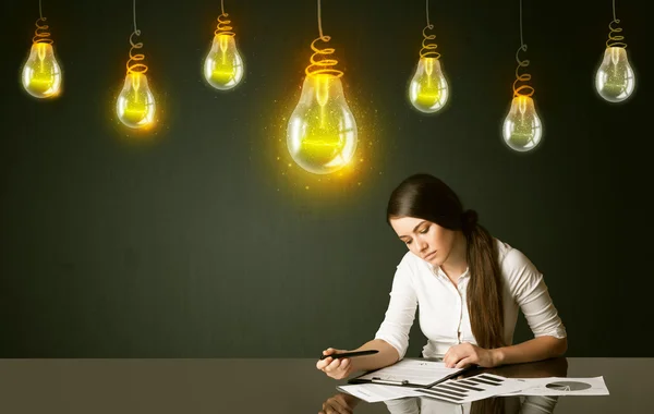 Businesswoman with idea bulbs