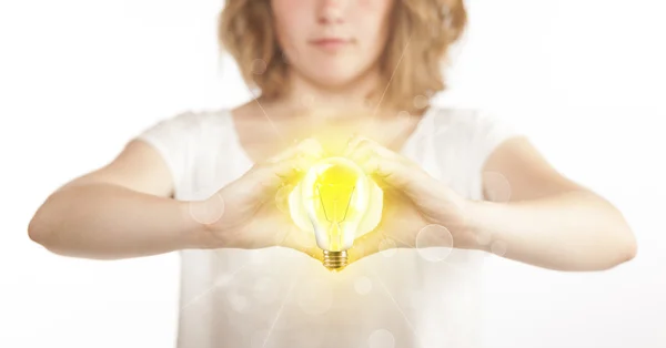 Hands creating a form with light bulb