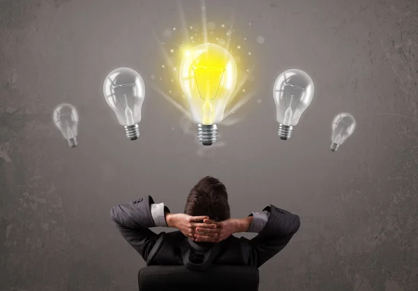 Business person having an idea light bulb concept