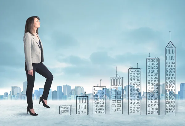 Business woman climbing up on hand drawn buildings in city