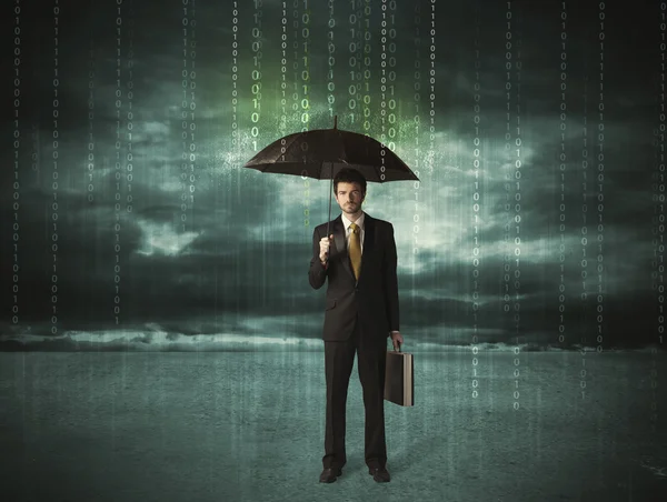 Business man standing with umbrella data protection concept