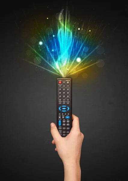 Hand with remote control and explosive signal