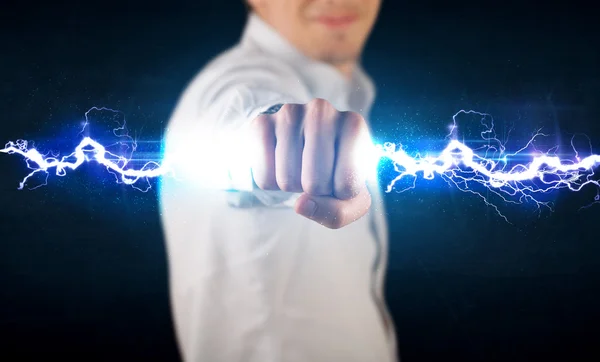 Business man holding electricity light bolt in his hands