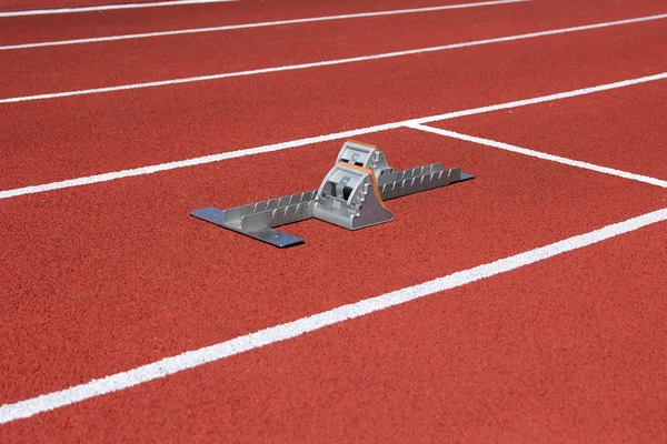 Athletics starting blocks on race track