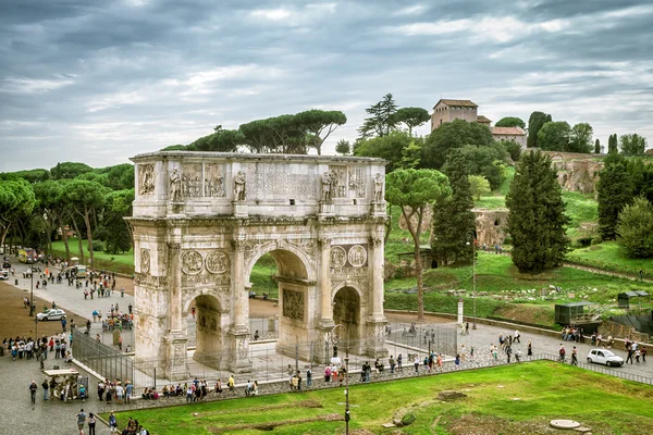 View the Arch of Constantine and Palatine Hill in Rome