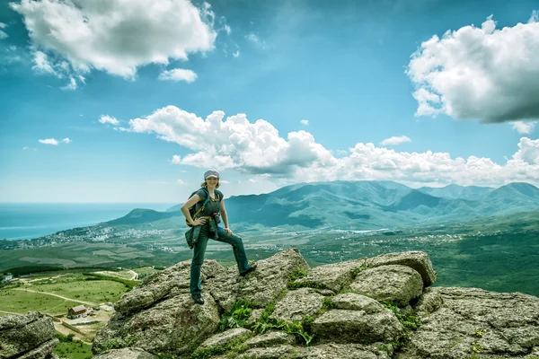 Young female tourist poses on the Demerdji mountain, Crimea