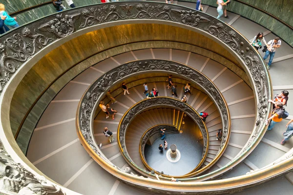 Tourists walk down the famous spiral staircase in Vatican Museum