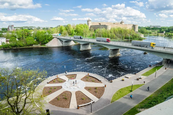 Narva River embankment with vacationers people and the border of Russia and the European Union