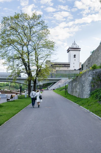 Narva River embankment with vacationers people and the border of Russia and the European Union