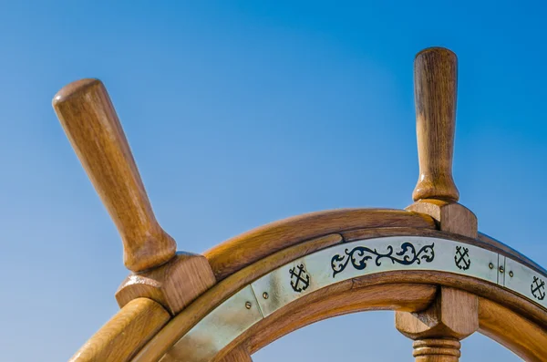 Steering wheel of an old sailing vessel, close up