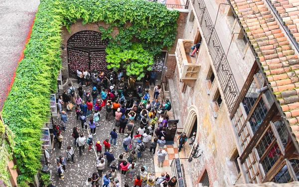 Tourists in the courtyard of Juliet's house. Verona, Italy