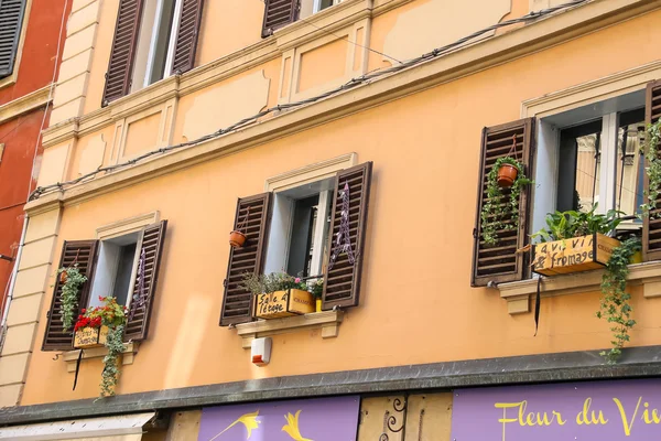 Decorative box with flowers over French food and wine shop