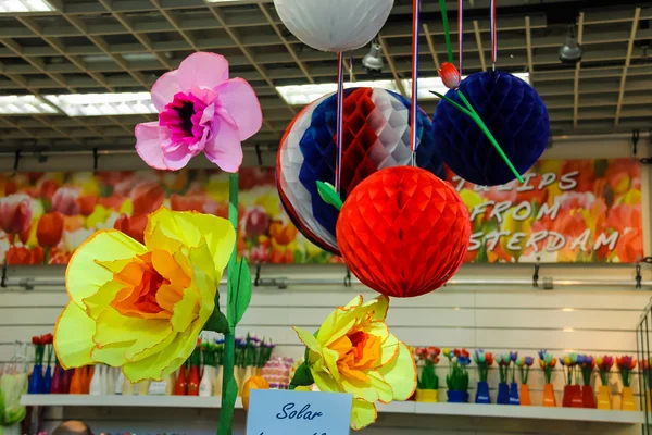 Artificial flowers and balloons decorate the gift shop at the ai