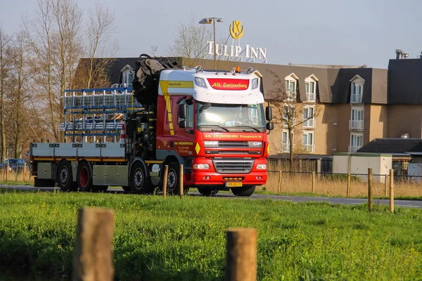 Truck is on the road near the company growing flowers. Meerkerk,