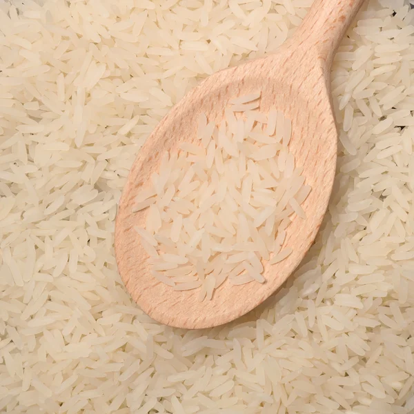 Raw rice with spoon