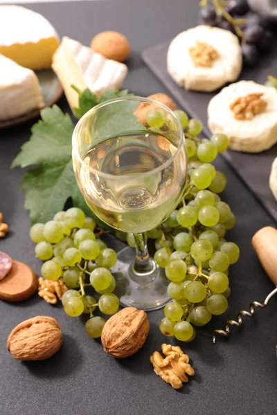 White wine, grapes and cheese