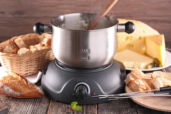 Cheese fondue in metal pan
