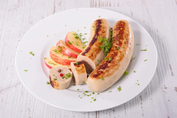 Grilled white sausages with apple