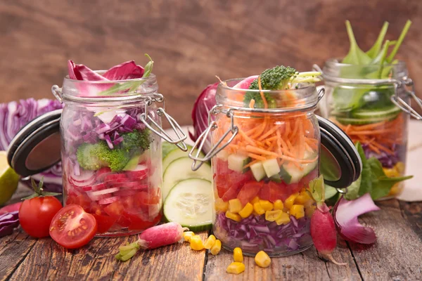 Vegetarian salad in jars