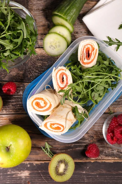 Lunch box with salmon wraps