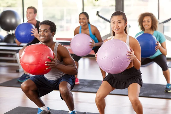 Gym class doing squats