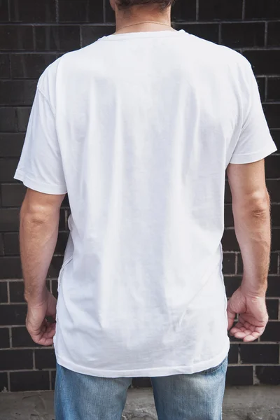 Muscular man back wearing white blank t-shirt