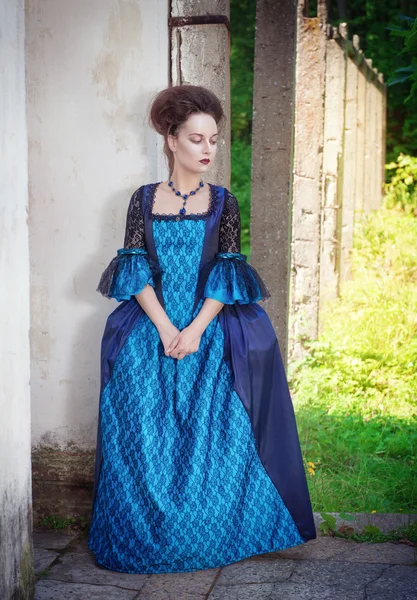 Beautiful young  woman in blue medieval dress