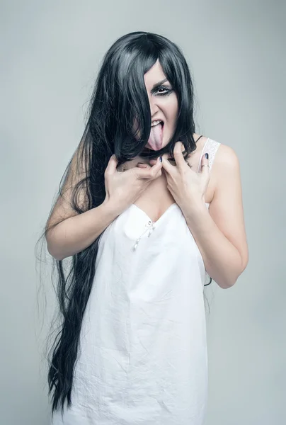 Mystical crazy  woman showing tongue