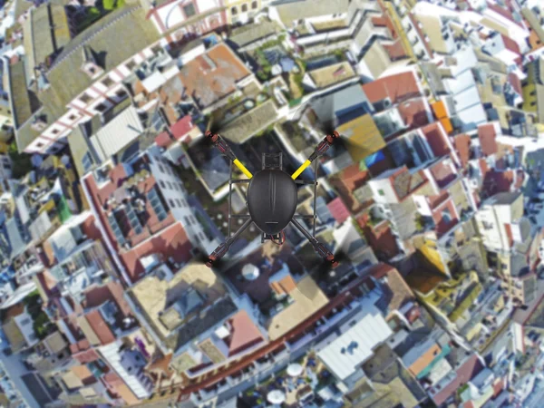 Quadcopter flying over roofs