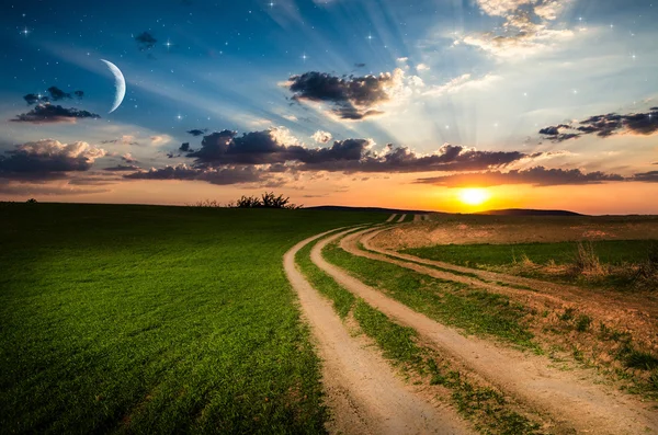 Rural road and sky with stars in the night