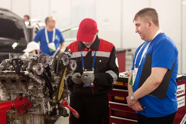 Young car mechanic passes competition stage.Tyumen