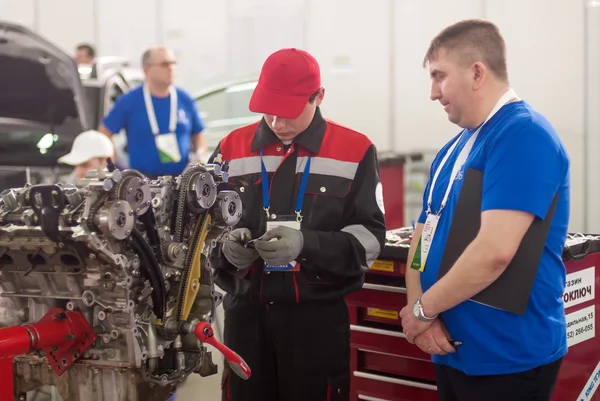 Young car mechanic passes competition stage.Tyumen