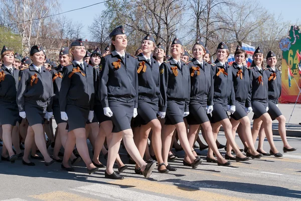 Female cadets of police academy marching on parade