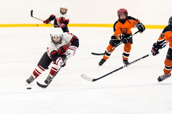 Game between children ice-hockey teams