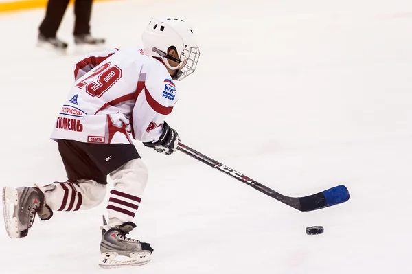 Game between children ice-hockey teams