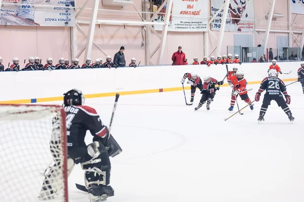 Attack in game between children ice-hockey teams
