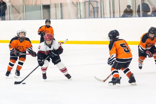 Game between children ice-hockey teams