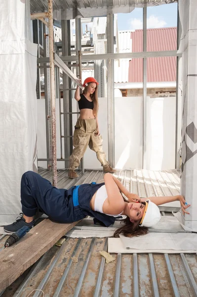 Attractive women relax on construction site